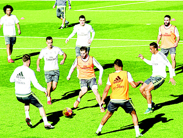 Real Madrid players take part in a training session at Valdebebas Sport city in Madrid on Nov 20, on the eve of their Spanish League ‘El Clasico’ football match Real Madrid vs FC Barcelona. (AFP)