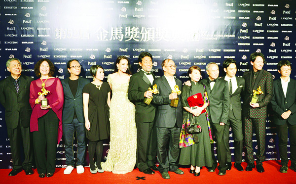 Taiwanese film director Hou Hsiao-hsien (fourth right), poses with the cast of his film ‘The Assassin’ after winning the Best Feature Film during the 52nd Golden Horse Film Awards in Taipei on Nov 21. (AFP)