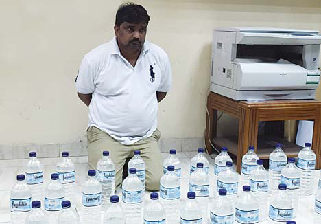 The Asian liquor peddler and contraband seized