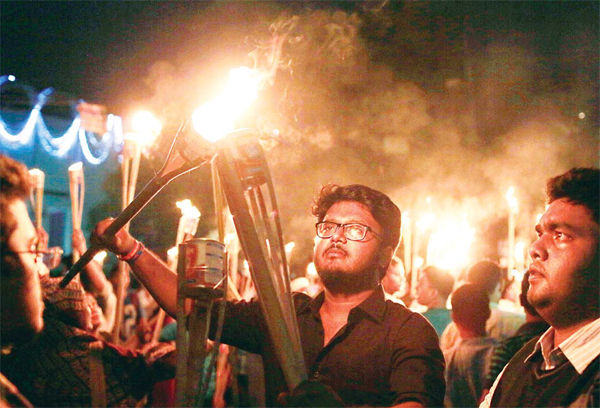 Bangladeshi activists, writers and publishers participate in a torch rally held to protest against the killing of Faisal Arefin Deepan, a publisher of secular books, and the attacks on other publishers and bloggers in Dhaka, Bangladesh on Nov 2. (AP)