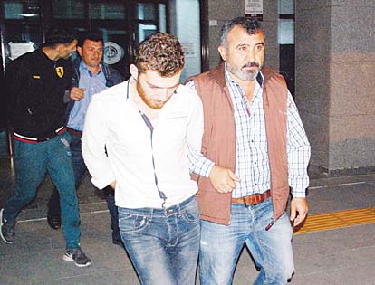 A 26-year-old Belgian citizen Ahmet Dahmani (back left), and a Syrian citizen (front left), are escorted by plain clothes police officers on Nov 20 in Antalya. Turkish police have arrested a Belgian man of Moroccan origin on suspicion he scouted out the target sites for Islamic State in attacks that killed 130 people in Paris a week ago, a Turkish government official said on Nov 21. (AFP)