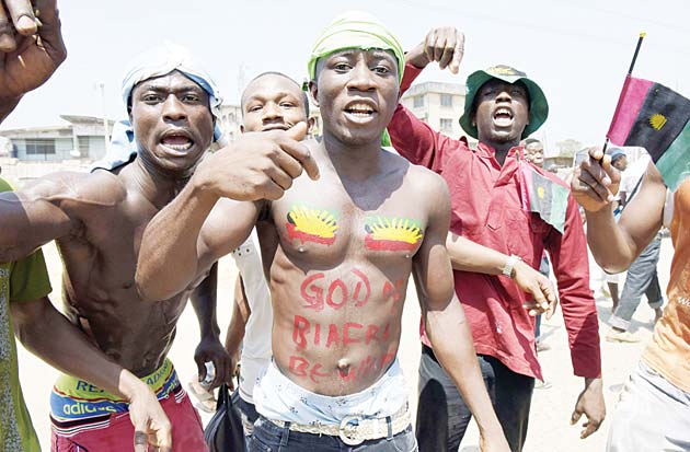 Pro-Biafra supporters shout slogans in Aba, southeastern Nigeria, during a protest calling for the release of a key activist on Nov 18. The protesters support the creation of a breakaway state of Biafra in the southeast and want the release of Nnamdi Kanu, who is believed to be a major sponsor of the Indigenous People of Biafra (IPOB) and director of the pirate radio station Radio Biafra. (AFP)