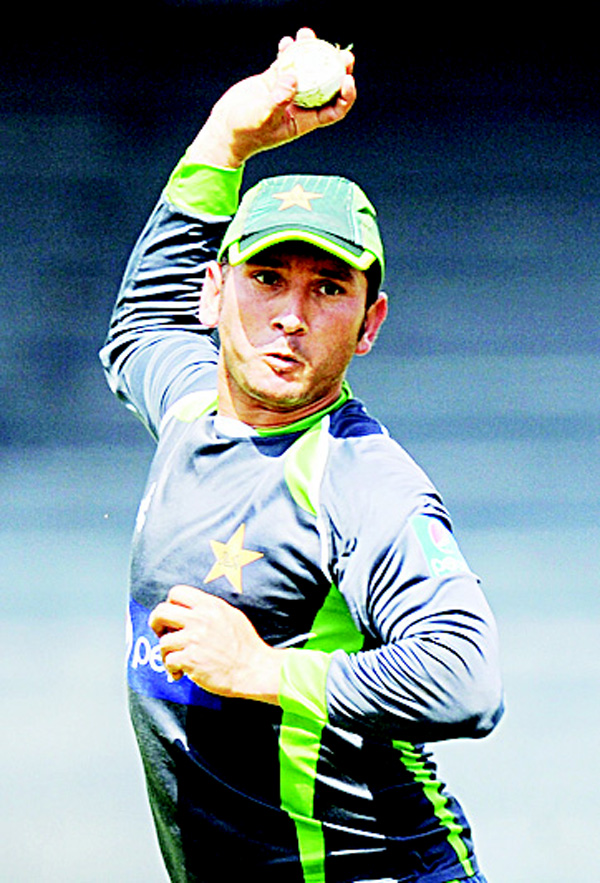 In this photograph taken on July 29, 2015, Pakistan cricketer Yasir Shah throws a ball during a practice session at the R. Premadasa International Cricket Stadium in Colombo. (AFP)