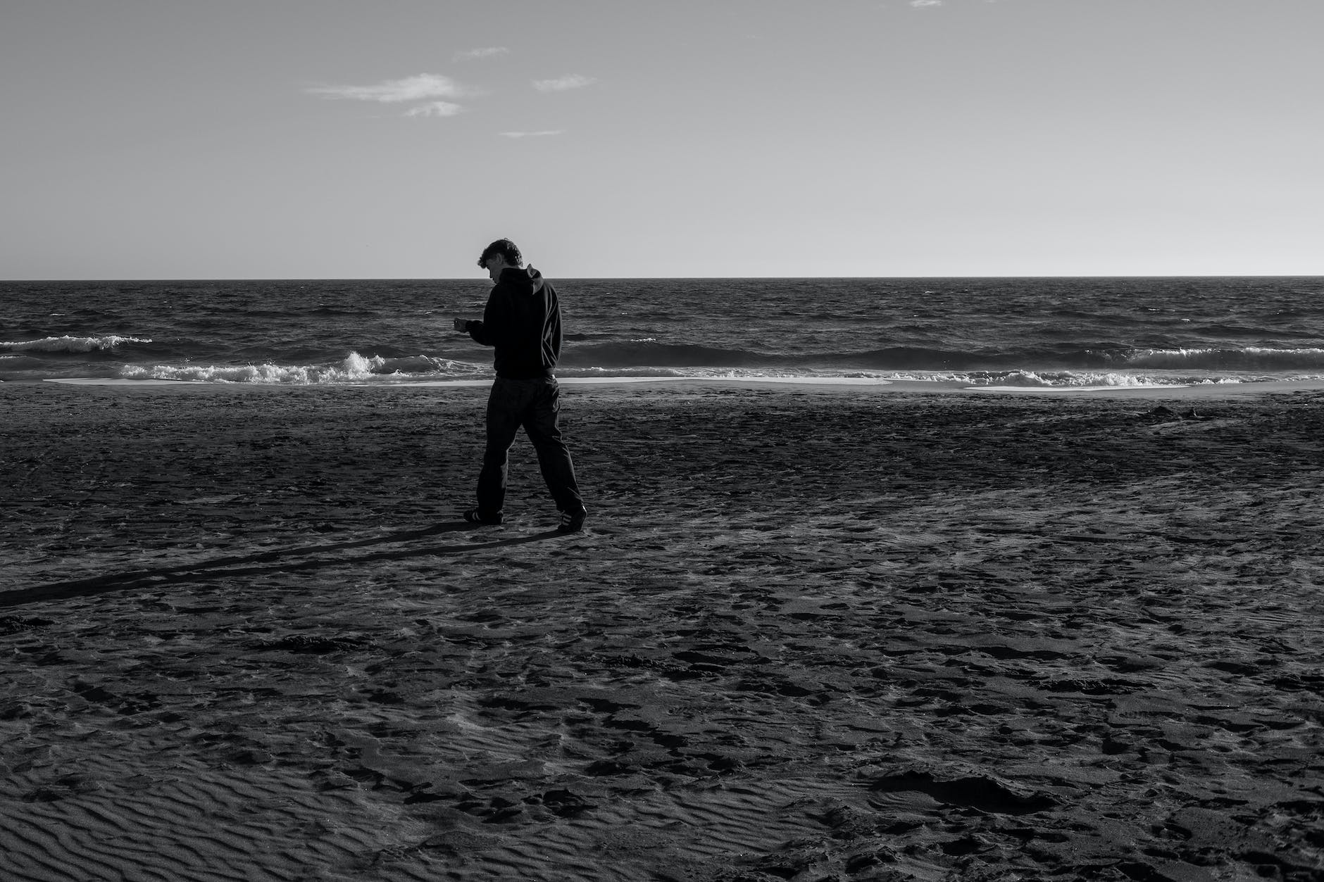a man walking on the beach