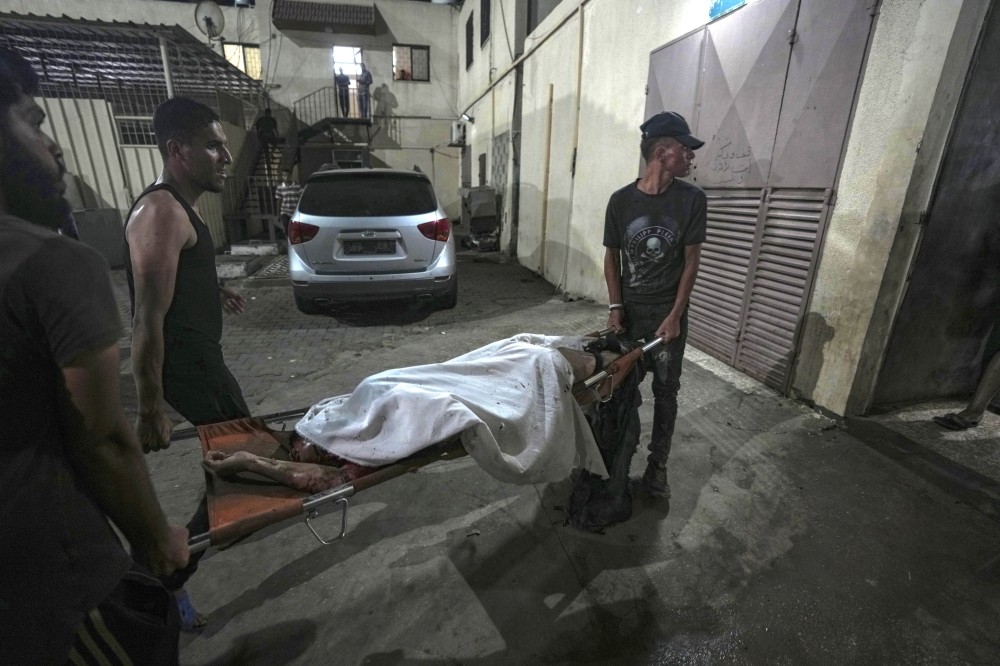 Israeli strikes on Gaza kill 18 and a stabbing in Tel Aviv kills 2 amid efforts to prevent wider war